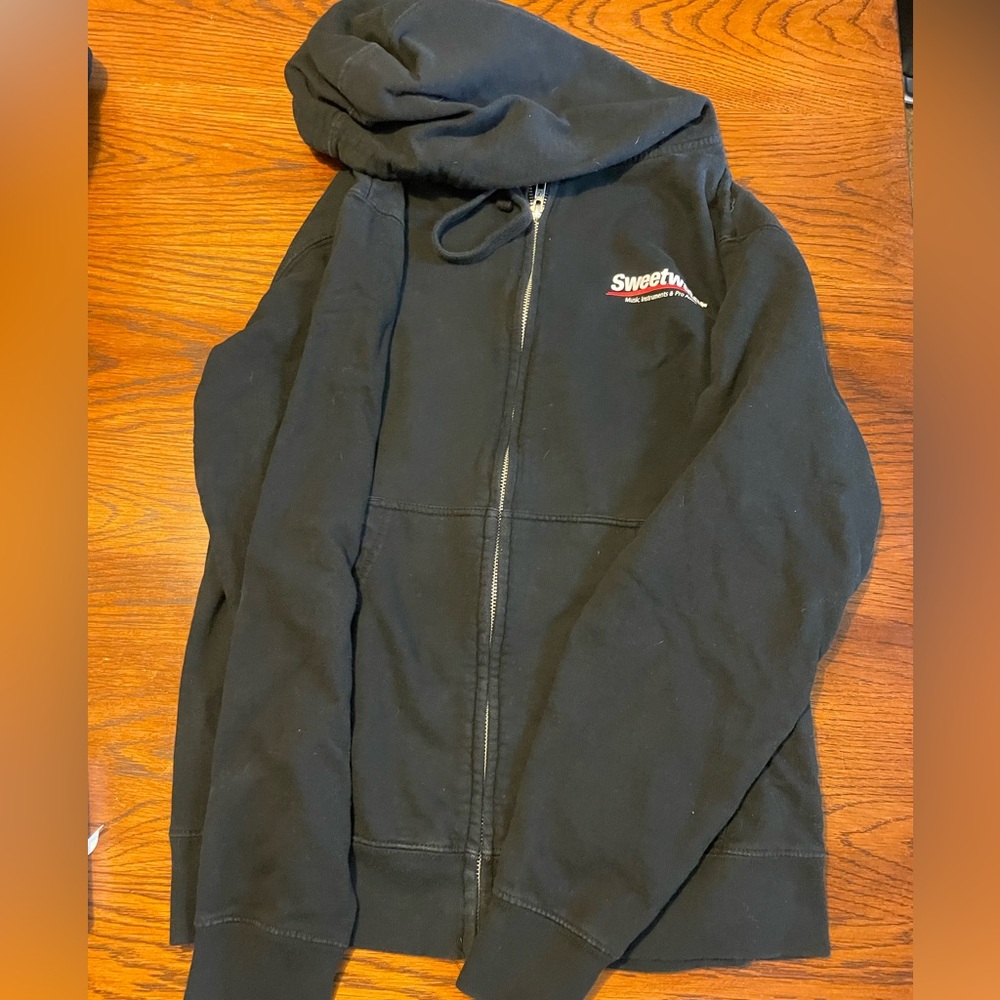Unisex - Sweetwater Sound black zip hooded jacket with front pockets.